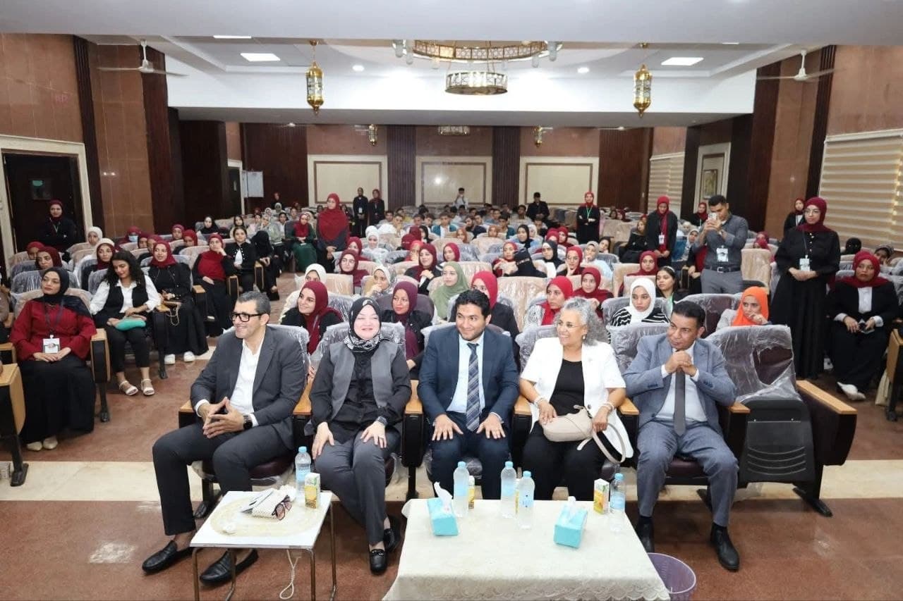 A large audience gathered inside an auditorium
